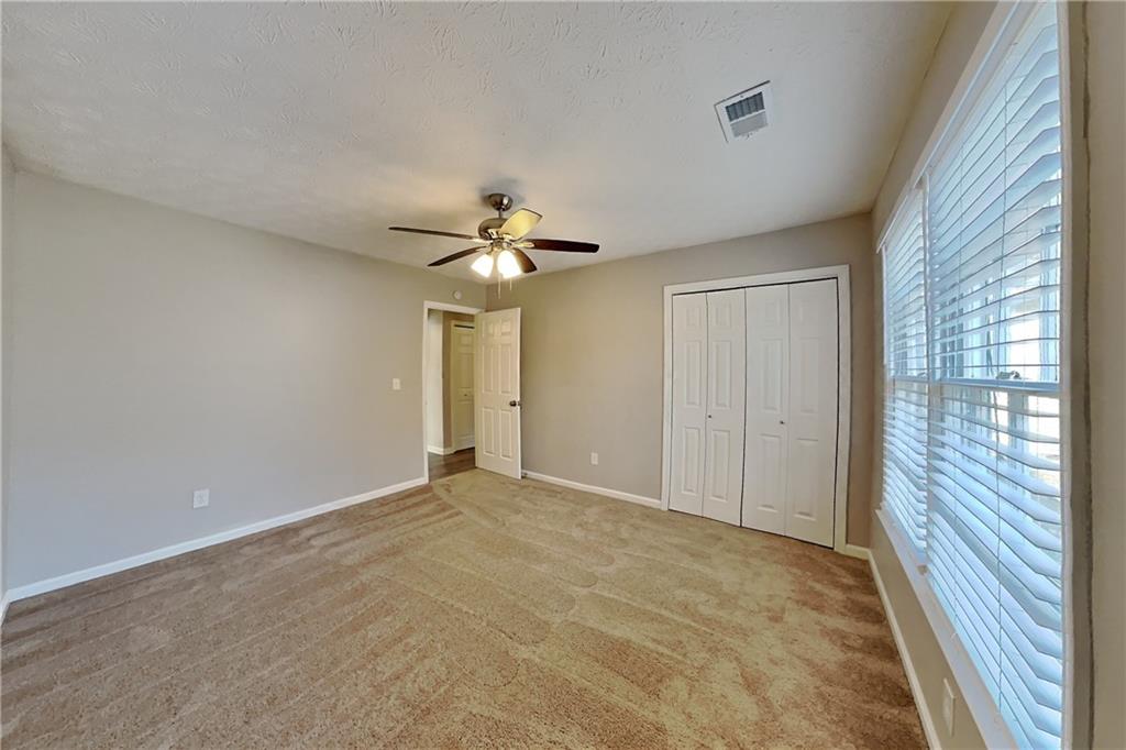 2705 Braemore Place Powder Springs, GA 30127 - Photo 12 of 18 a view of an empty room with a window