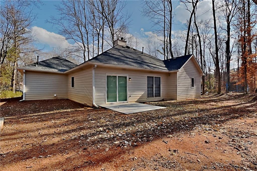 2705 Braemore Place Powder Springs, GA 30127 - Photo 17 of 18 a front view of a house with a yard