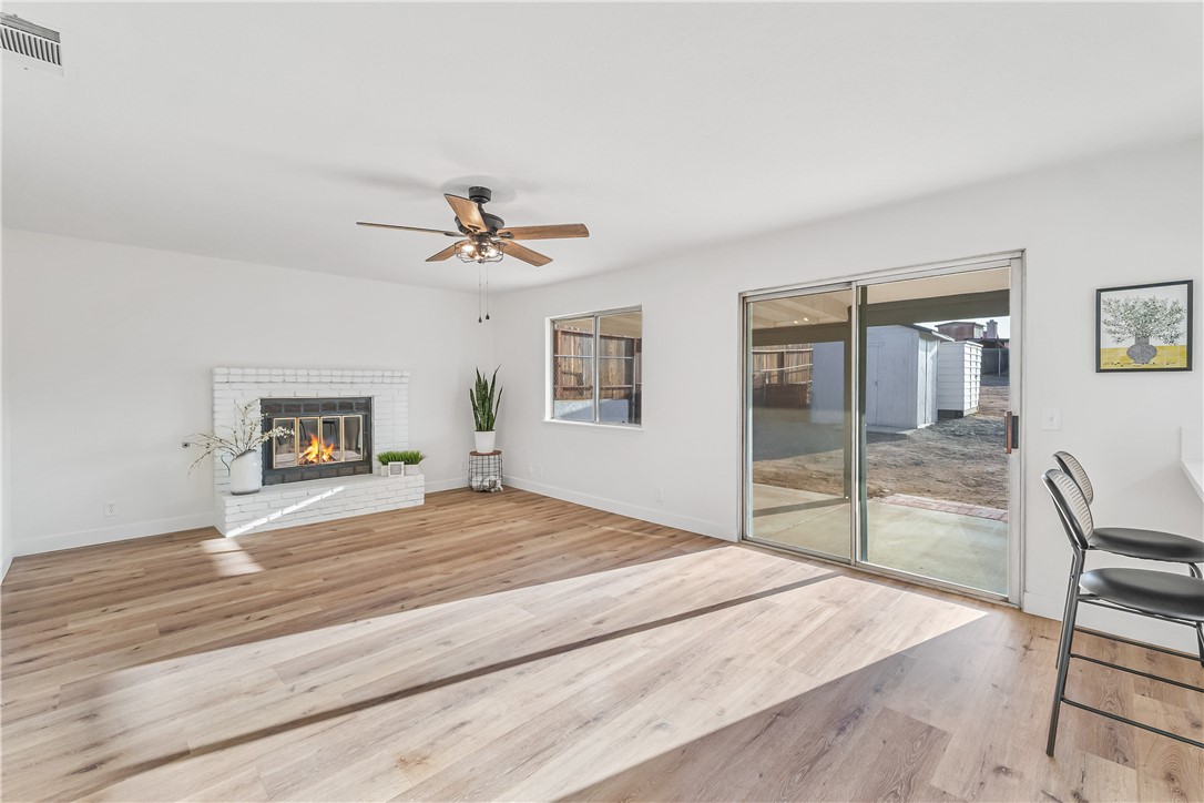 7046 Seventh Avenue Hesperia, CA 92345 - Photo 20 of 46 a bedroom with a bed and a chandelier