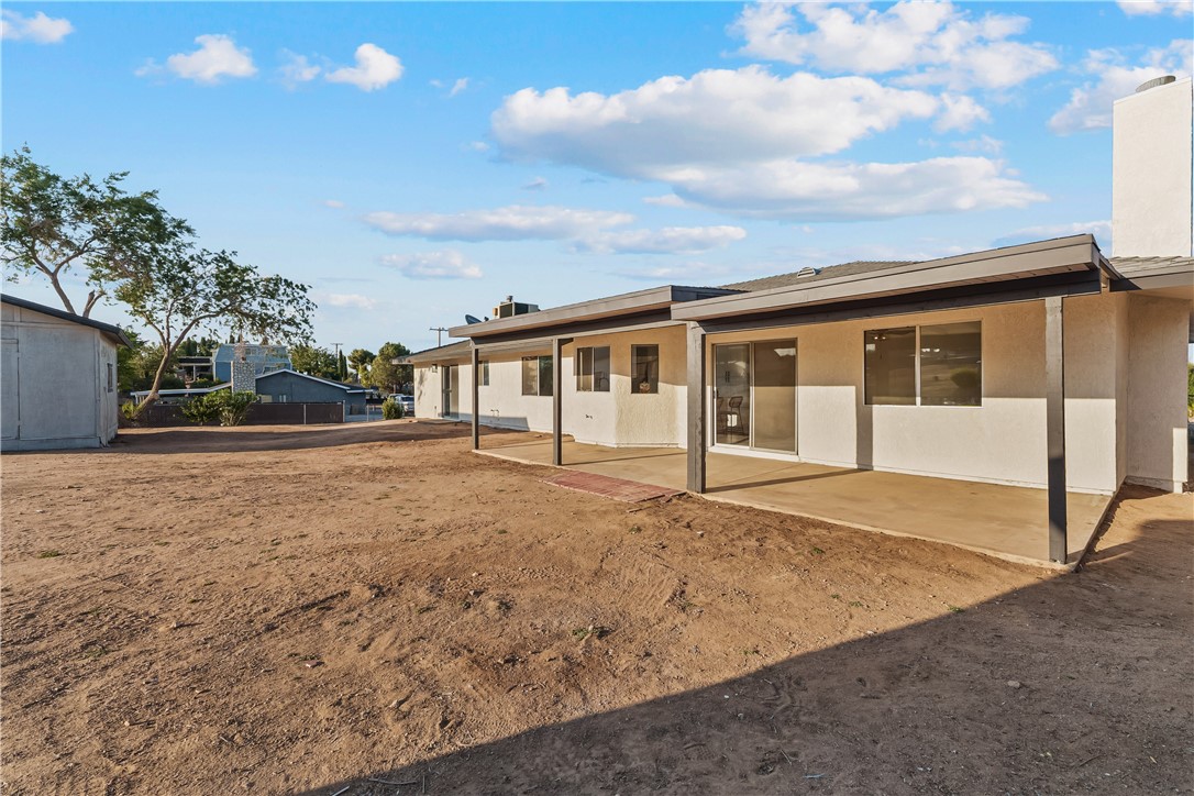 7046 Seventh Avenue Hesperia, CA 92345 - Photo 34 of 46 a house view with a backyard space