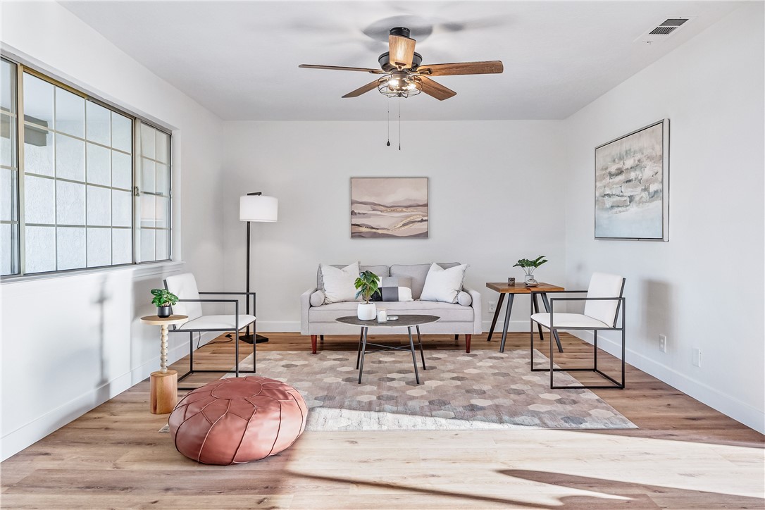 7046 Seventh Avenue Hesperia, CA 92345 - Photo 8 of 46 a living room with furniture and a rug