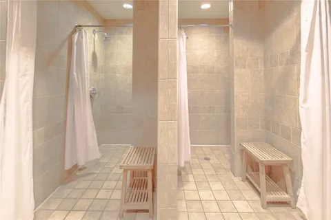 a bathroom with a shower and a tub