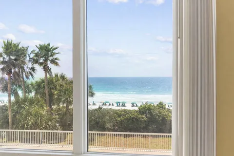 a view of a glass door and mountain view