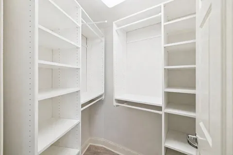 a view of an empty walk in closet