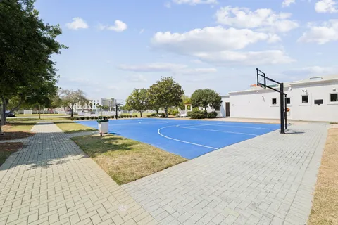 a view of yard with swimming pool and trees in the background