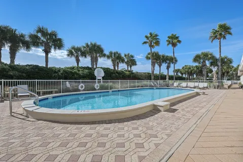 a view of a swimming pool with a patio
