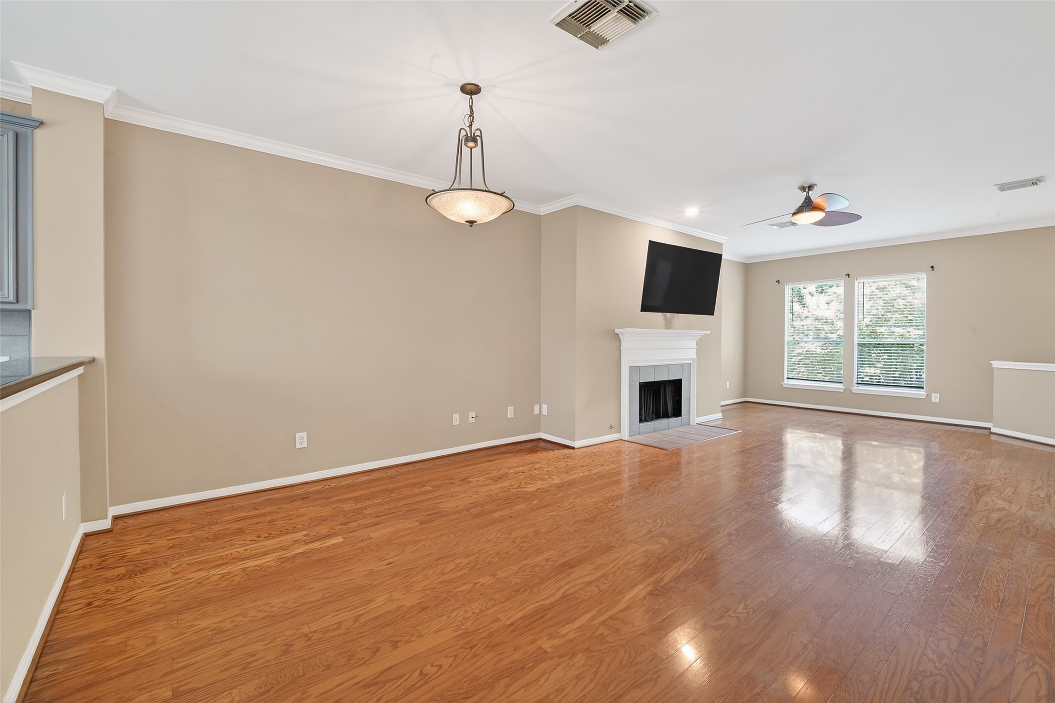 2804 Chenevert Street Houston, TX 77004 - Photo 18 of 37 wooden floor in an empty room with a fireplace