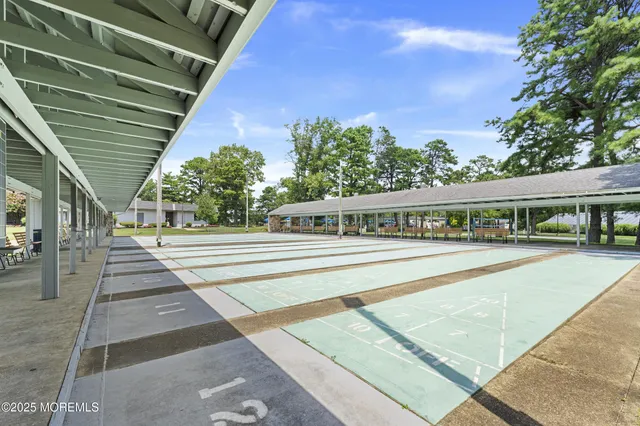 a view of a swimming pool with outdoor seating