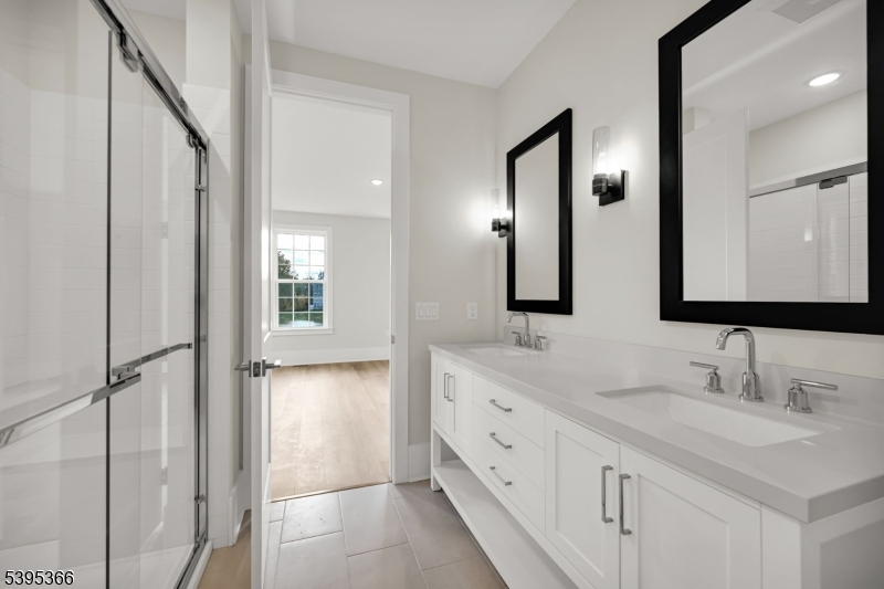 127 Myrtle Road Warren, NJ 07059 - Photo 16 of 27 a bathroom with a double vanity sink and mirror
