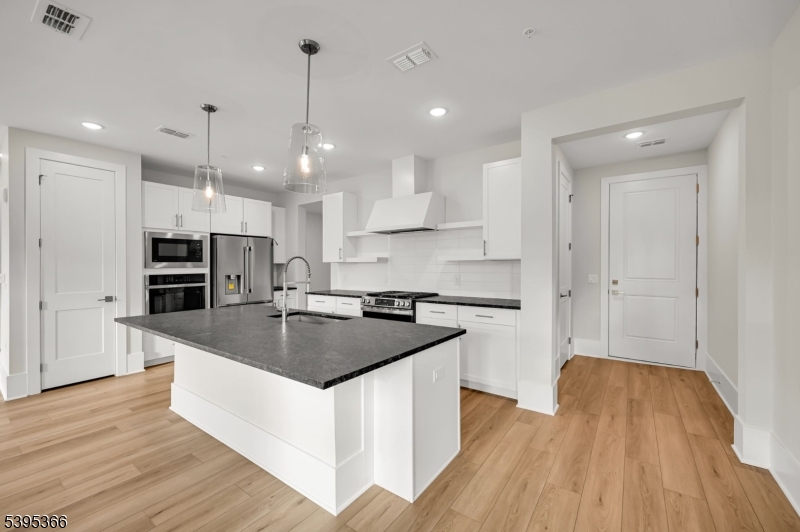 127 Myrtle Road Warren, NJ 07059 - Photo 3 of 27 a kitchen with stainless steel appliances granite countertop a sink stove and refrigerator