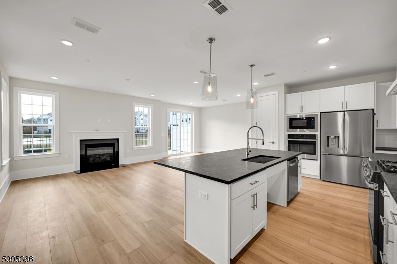 127 Myrtle Road Warren, NJ 07059 - Photo 6 of 27 a kitchen with stainless steel appliances granite countertop a stove a sink and a refrigerator