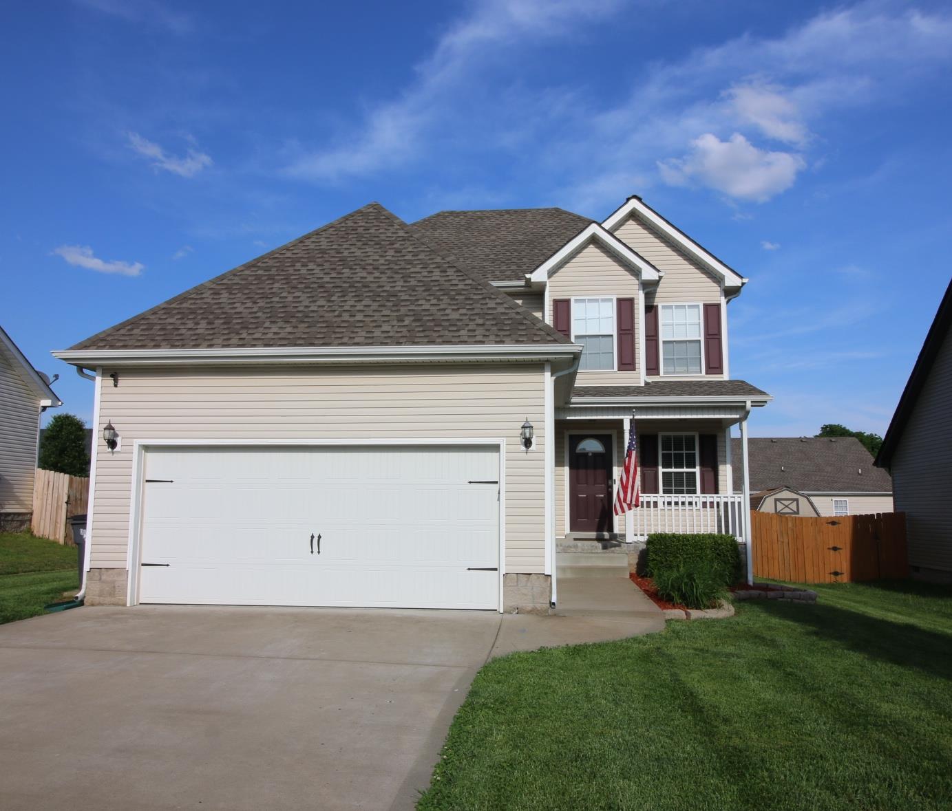 3729 Suiter Road Clarksville, TN 37040 - Photo 2 of 3 a front view of a house with a yard and garage