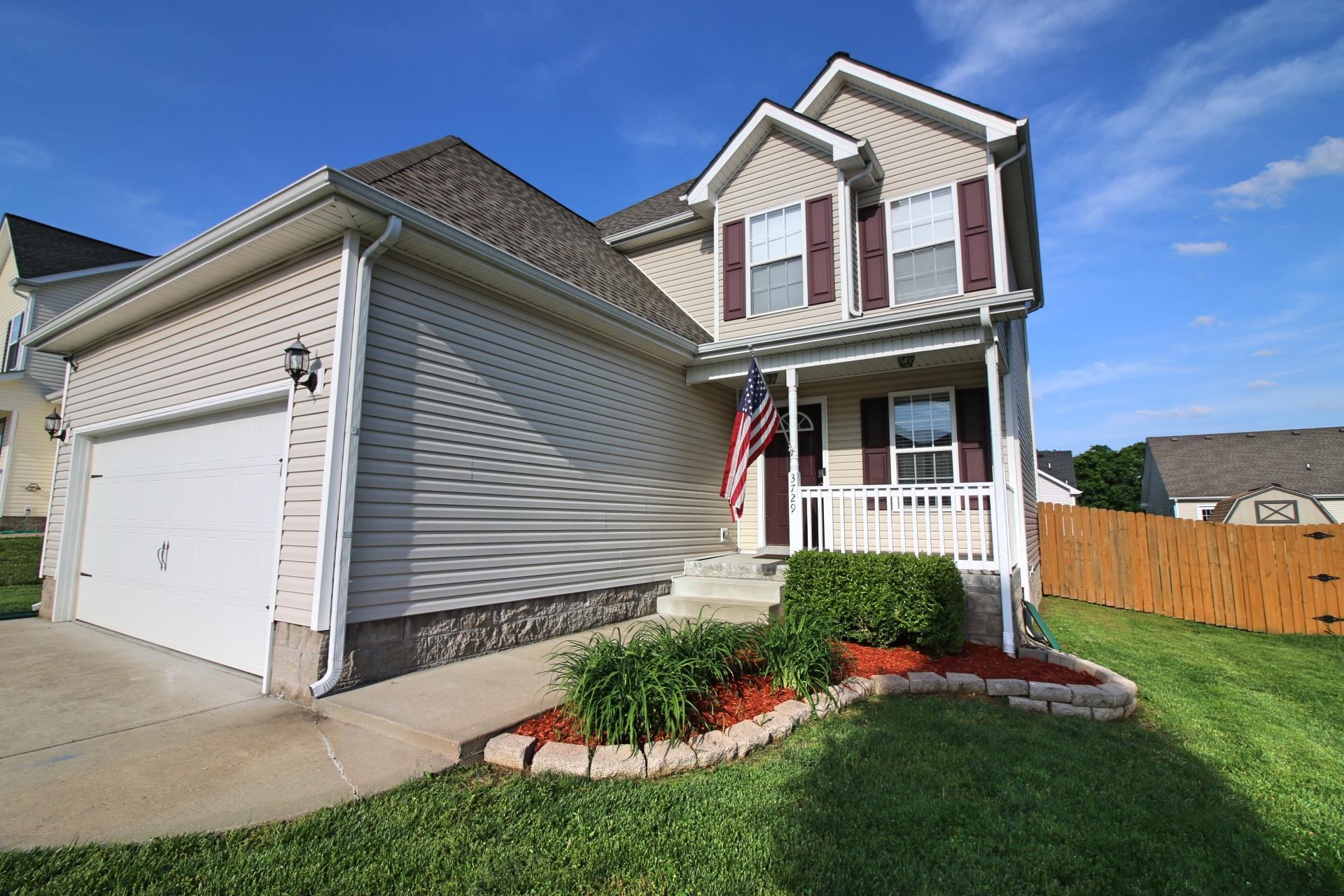 3729 Suiter Road Clarksville, TN 37040 - Photo 3 of 3 a front view of a house with a yard