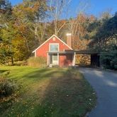 a backyard of a house with lots of green space