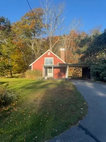 a backyard of a house with lots of green space