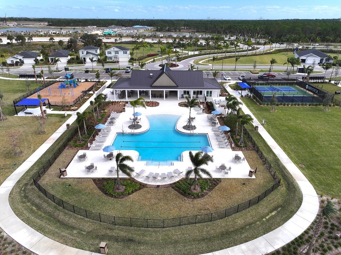 11247 Barnstead Way Port St. Lucie, FL 34987 - Photo 4 of 10 a view of a swimming pool with seating area