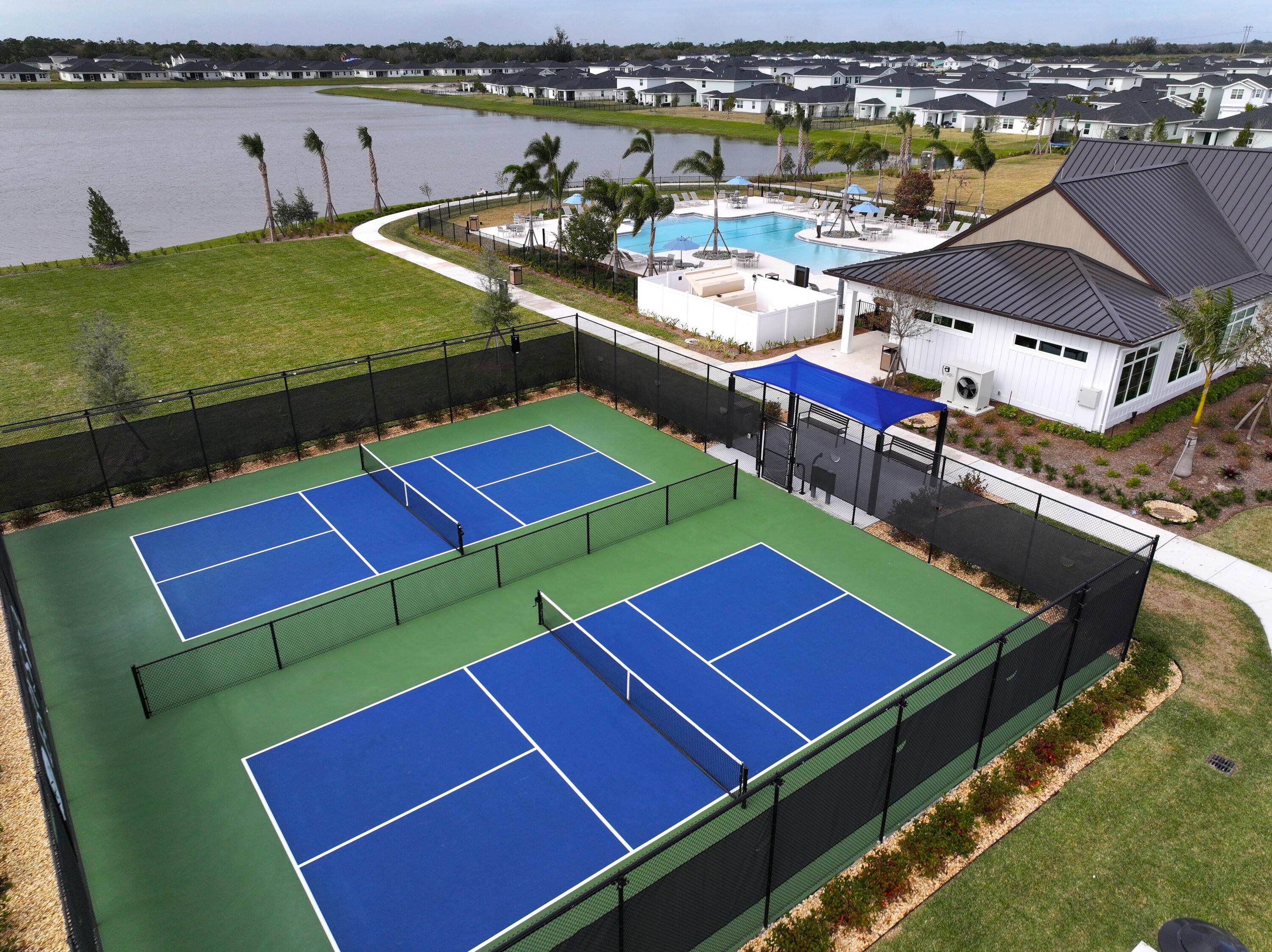 11247 Barnstead Way Port St. Lucie, FL 34987 - Photo 5 of 10 a view of a tennis ground with furniture