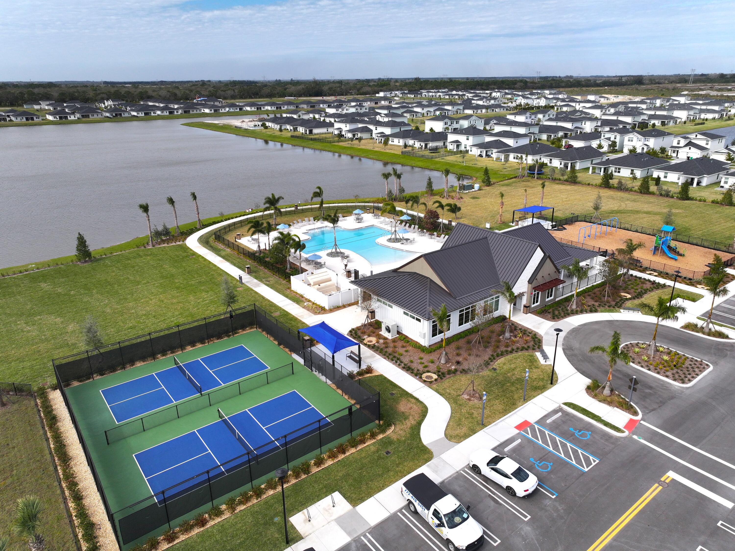 11247 Barnstead Way Port St. Lucie, FL 34987 - Photo 6 of 10 an aerial view of a rooftop deck and lake view