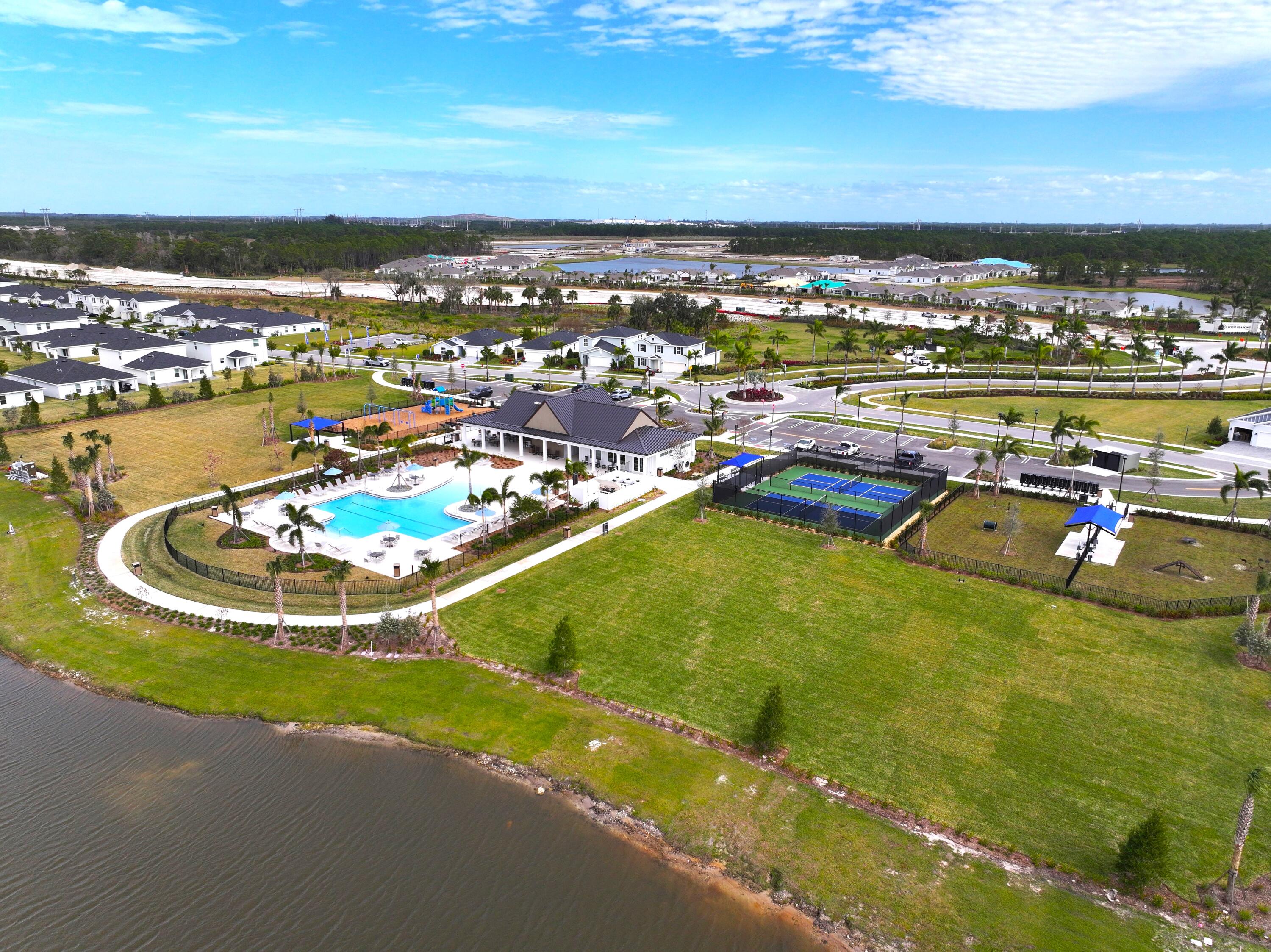 11247 Barnstead Way Port St. Lucie, FL 34987 - Photo 8 of 10 a view of a swimming pool and an ocean view
