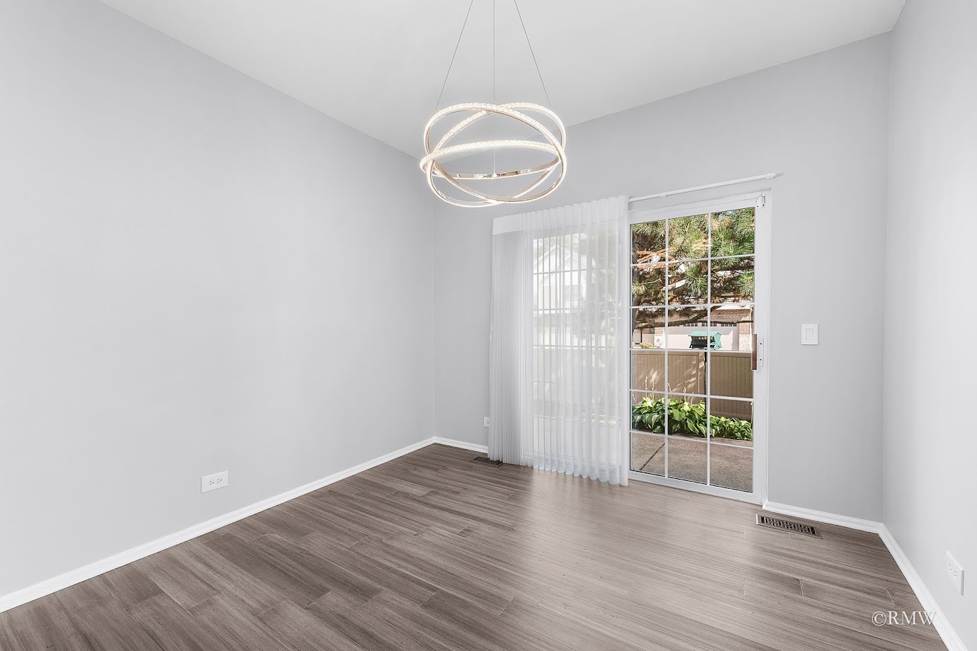 101 Bay Drive Itasca, IL 60143 - Photo 13 of 29 a view of a room with wooden floor and window