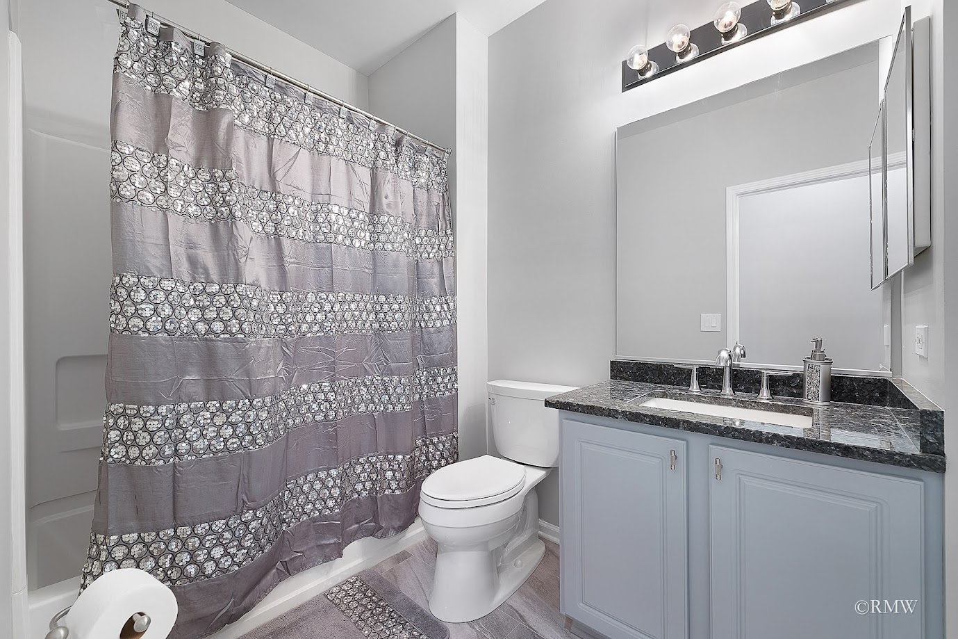 101 Bay Drive Itasca, IL 60143 - Photo 15 of 29 a bathroom with a granite countertop toilet sink and mirror