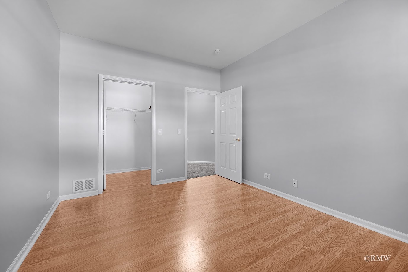 101 Bay Drive Itasca, IL 60143 - Photo 17 of 29 a view of an empty room with wooden floor