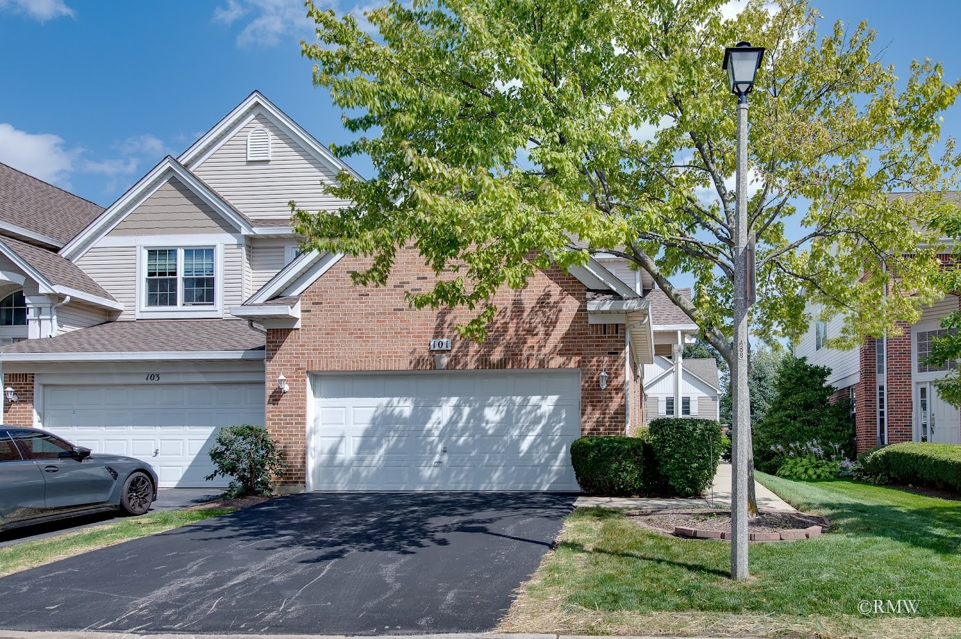 101 Bay Drive Itasca, IL 60143 - Photo 3 of 29 a front view of a house with a yard and garage