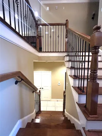 a view of entryway and hall with wooden floor