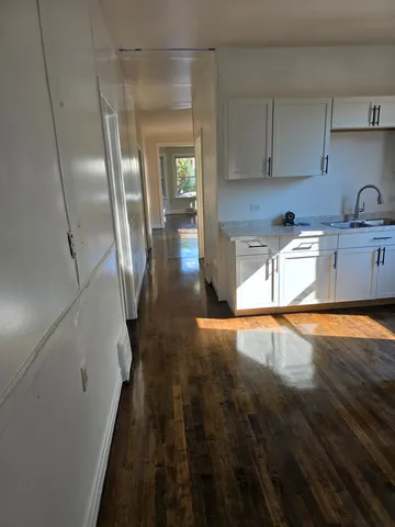 a view of a kitchen with a sink and dishwasher