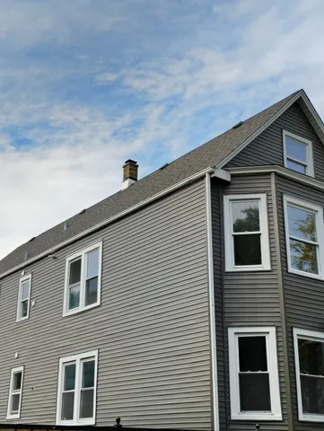 a front view of a house with garage