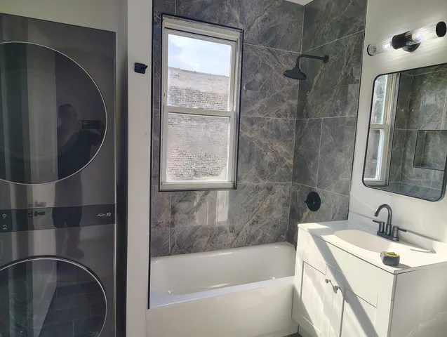 a bathroom with a bathtub and a sink