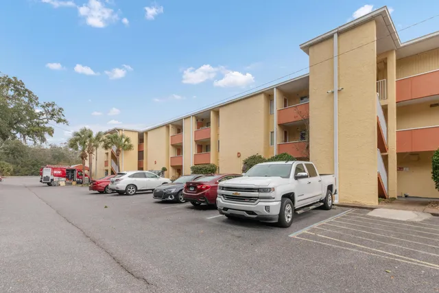 a view of a cars park in front of house