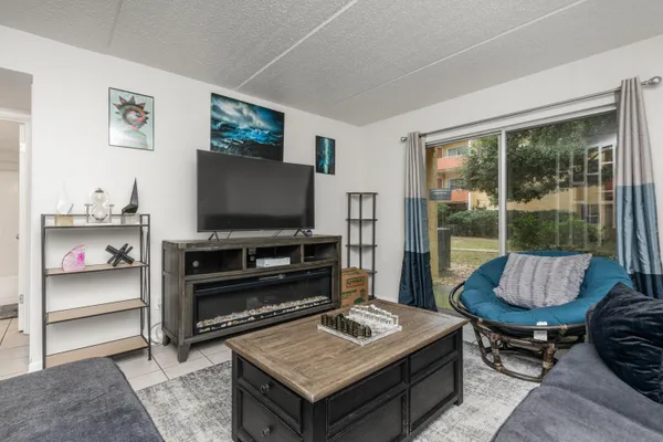 a living room with furniture and a flat screen tv
