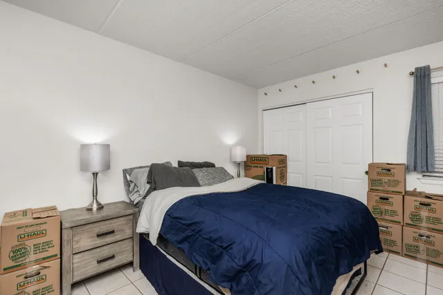 a bedroom with a bed and dresser