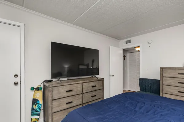 a room with furniture and flat screen tv