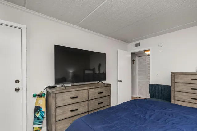 a room with furniture and flat screen tv