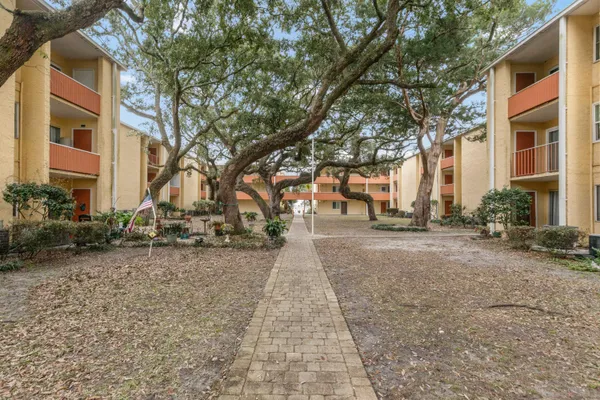 a view of a building with a yard