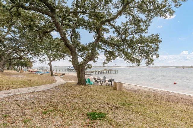 a view of outdoor space with deck and trees