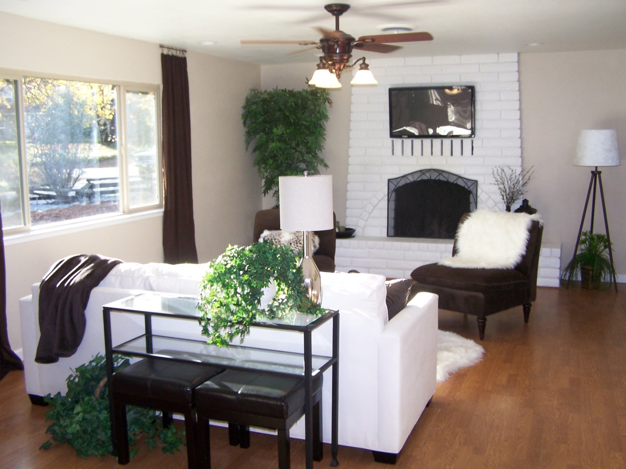 17824 Walker Mine Road Redding, CA 96003 - Photo 3 of 12 a living room with furniture a fireplace and a flat screen tv