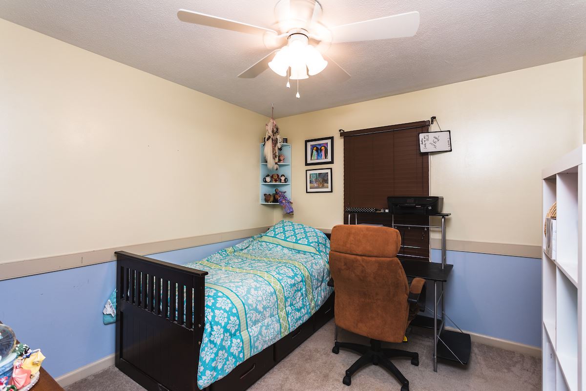 33 Ox Road Waynesboro, VA 22980 - Photo 9 of 17 a bedroom with a bed and a chandelier