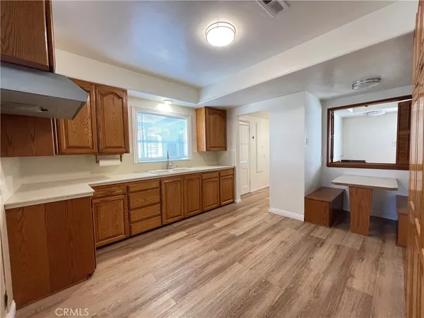 a spacious bathroom with a double vanity sink and a mirror