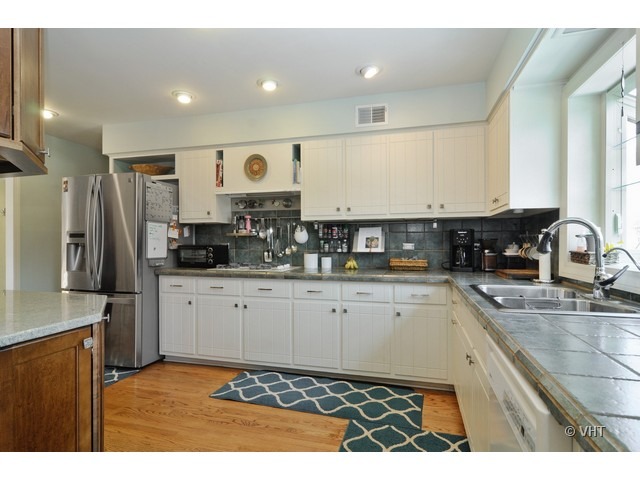 170 Cold Spring Road Barrington, IL 60010 - Photo 3 of 10 a kitchen with stainless steel appliances granite countertop a refrigerator a stove a sink and white cabinets