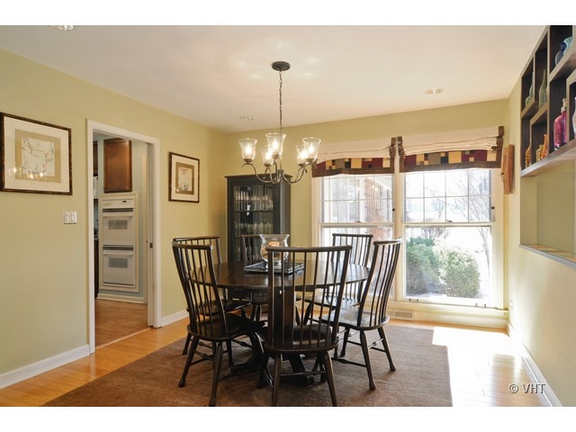 170 Cold Spring Road Barrington, IL 60010 - Photo 5 of 10 a dining room with furniture a chandelier and window