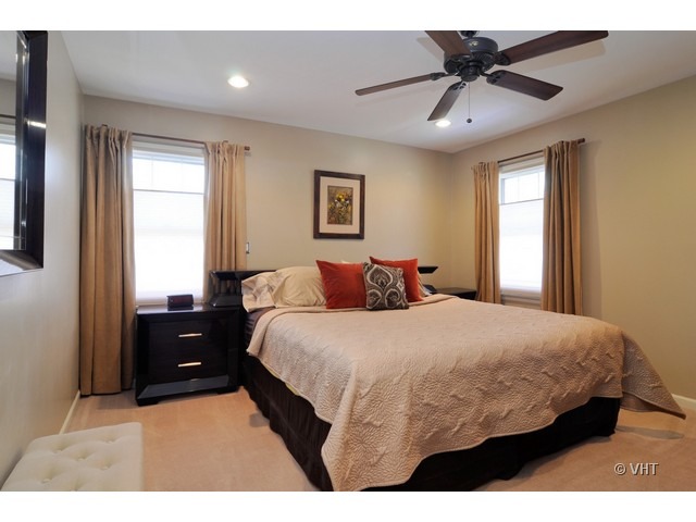 170 Cold Spring Road Barrington, IL 60010 - Photo 7 of 10 a bedroom with a bed and a chandelier