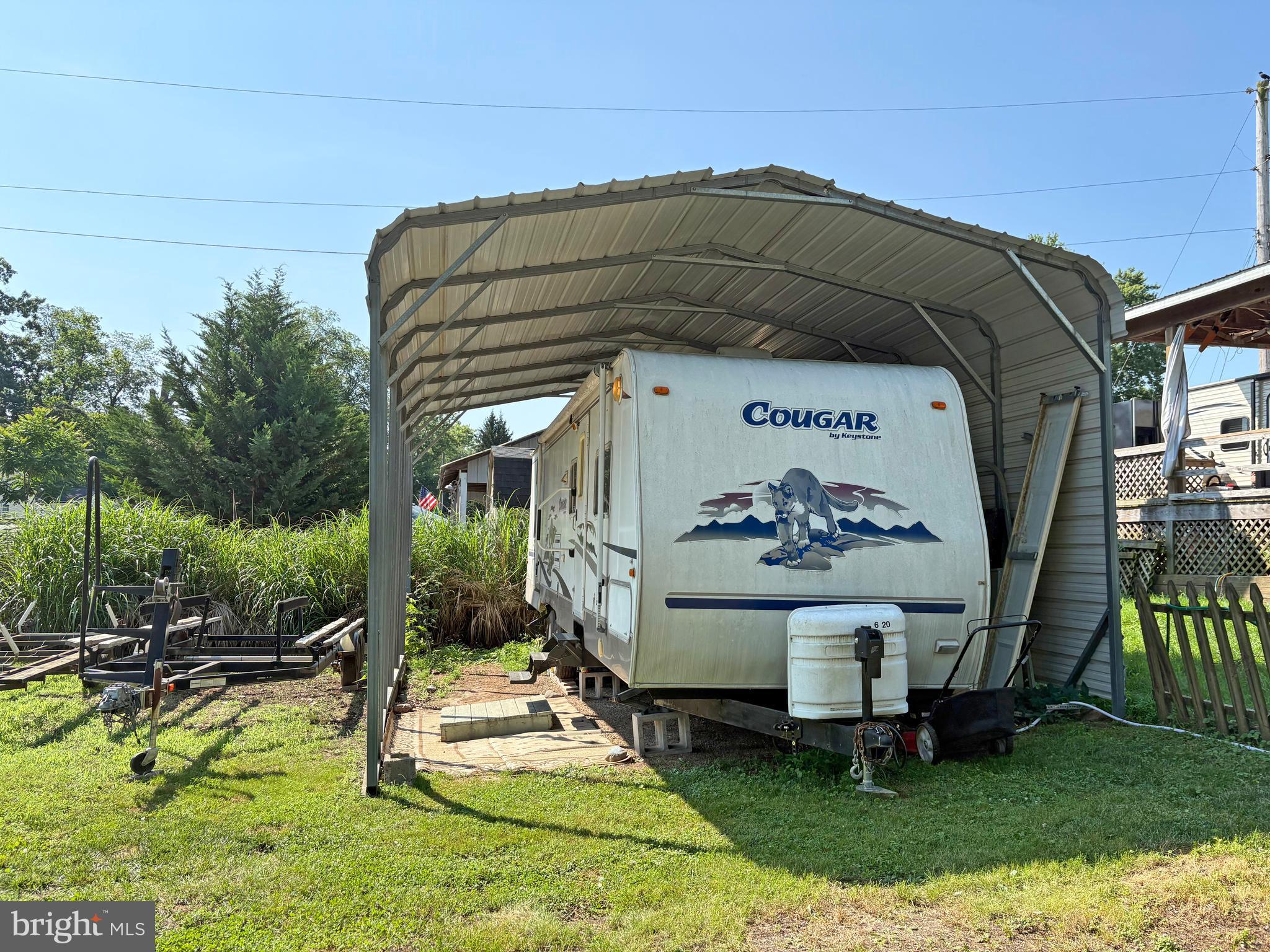 6-20 Boo Boo Boulevard Falling Waters, WV 25419 - Photo 2 of 16 a view of backyard with a table and chairs