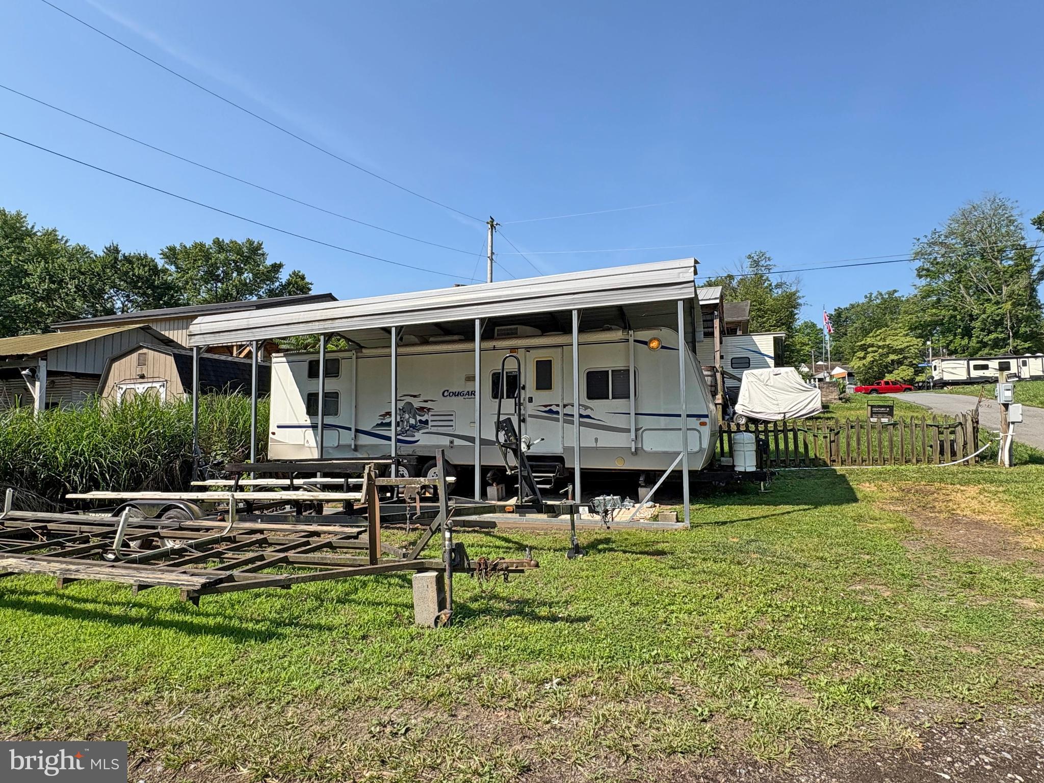 6-20 Boo Boo Boulevard Falling Waters, WV 25419 - Photo 3 of 16 a view of a house with backyard porch and sitting area