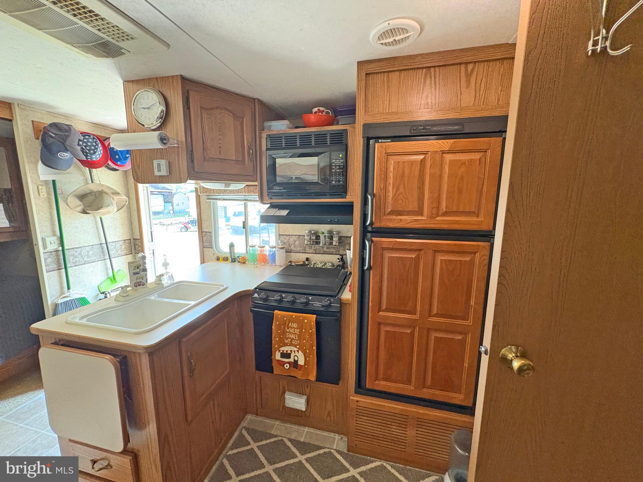 6-20 Boo Boo Boulevard Falling Waters, WV 25419 - Photo 8 of 16 a kitchen with stainless steel appliances granite countertop a refrigerator and a stove