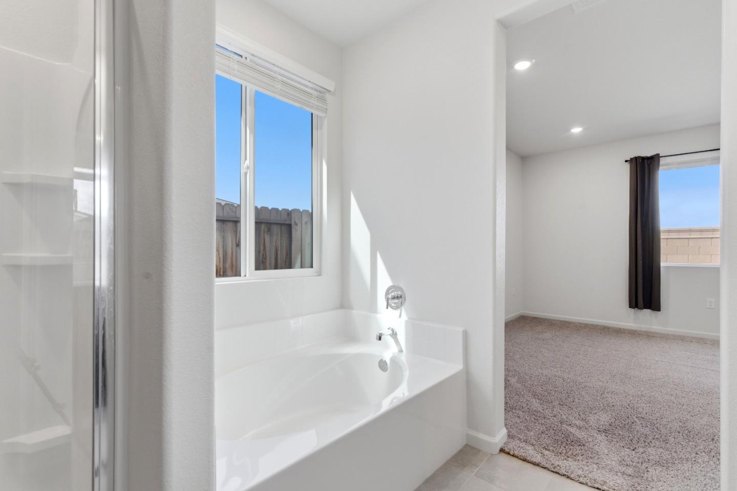 331 Lolly Way Los Banos, CA 93635 - Photo 12 of 31 a bathroom with bathtub and shower