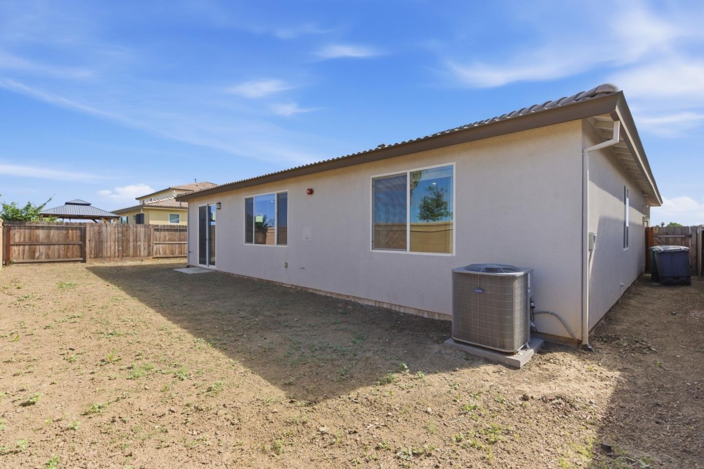 331 Lolly Way Los Banos, CA 93635 - Photo 28 of 31 a backyard of a house with a garage