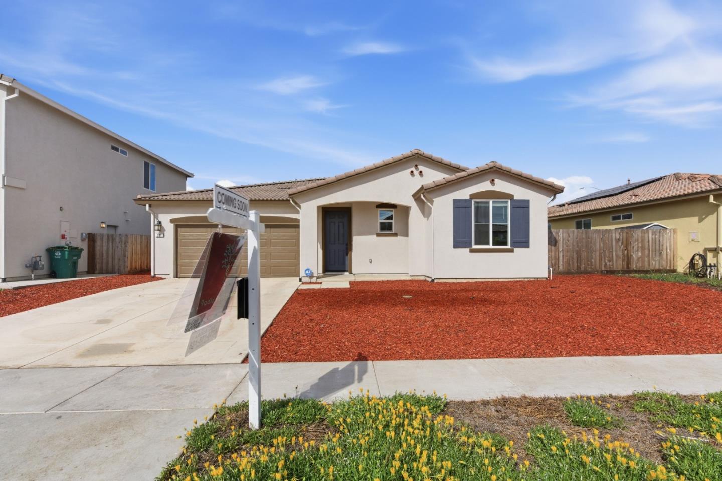 331 Lolly Way Los Banos, CA 93635 - Photo 3 of 31 a front view of a house with a yard and garage